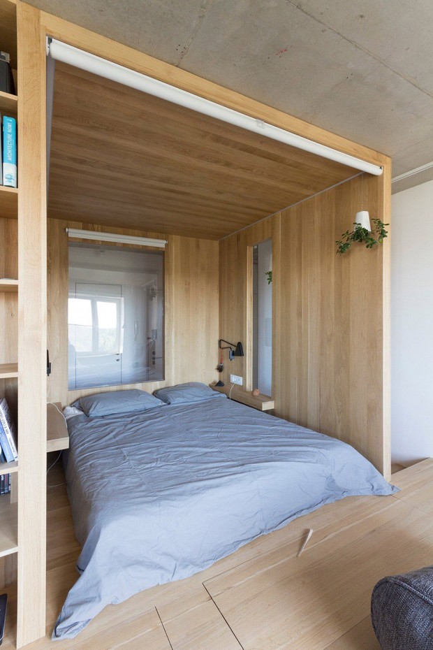 bedroom-grey-bedding-window-looking-onto-wall-